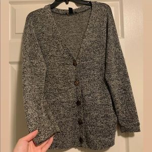 Cardigan sweater with functional buttons